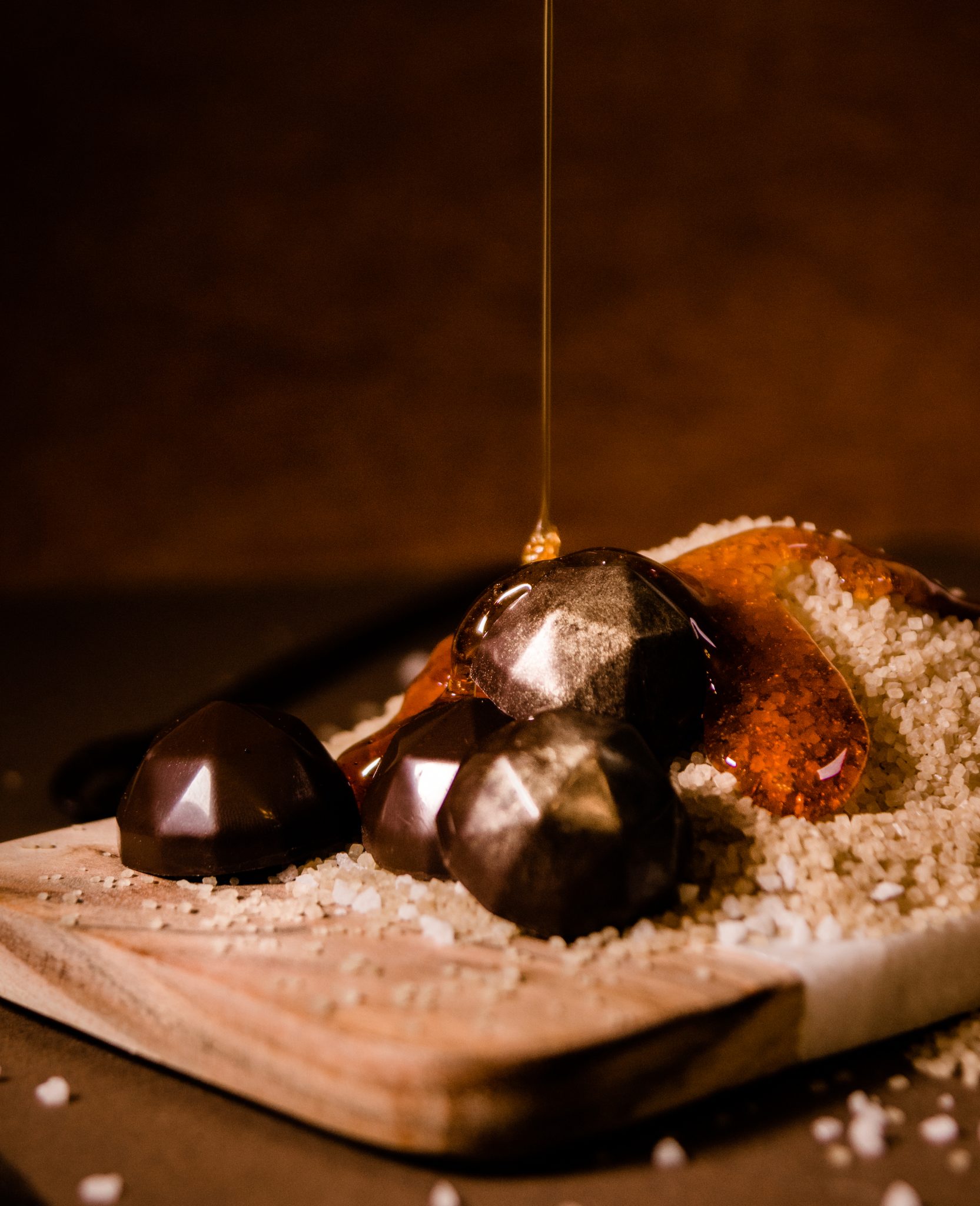 background-caramel-dropping-on-chocolates